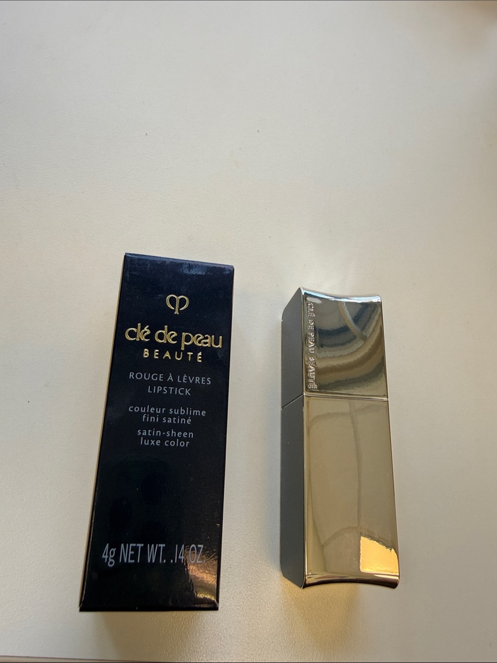 cle de peau beauty red Satin Lipstick in 103 Legend of Rouge